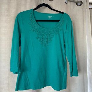 Teal toned comfy casual top w/feminine embroidery detail at the scoop neck